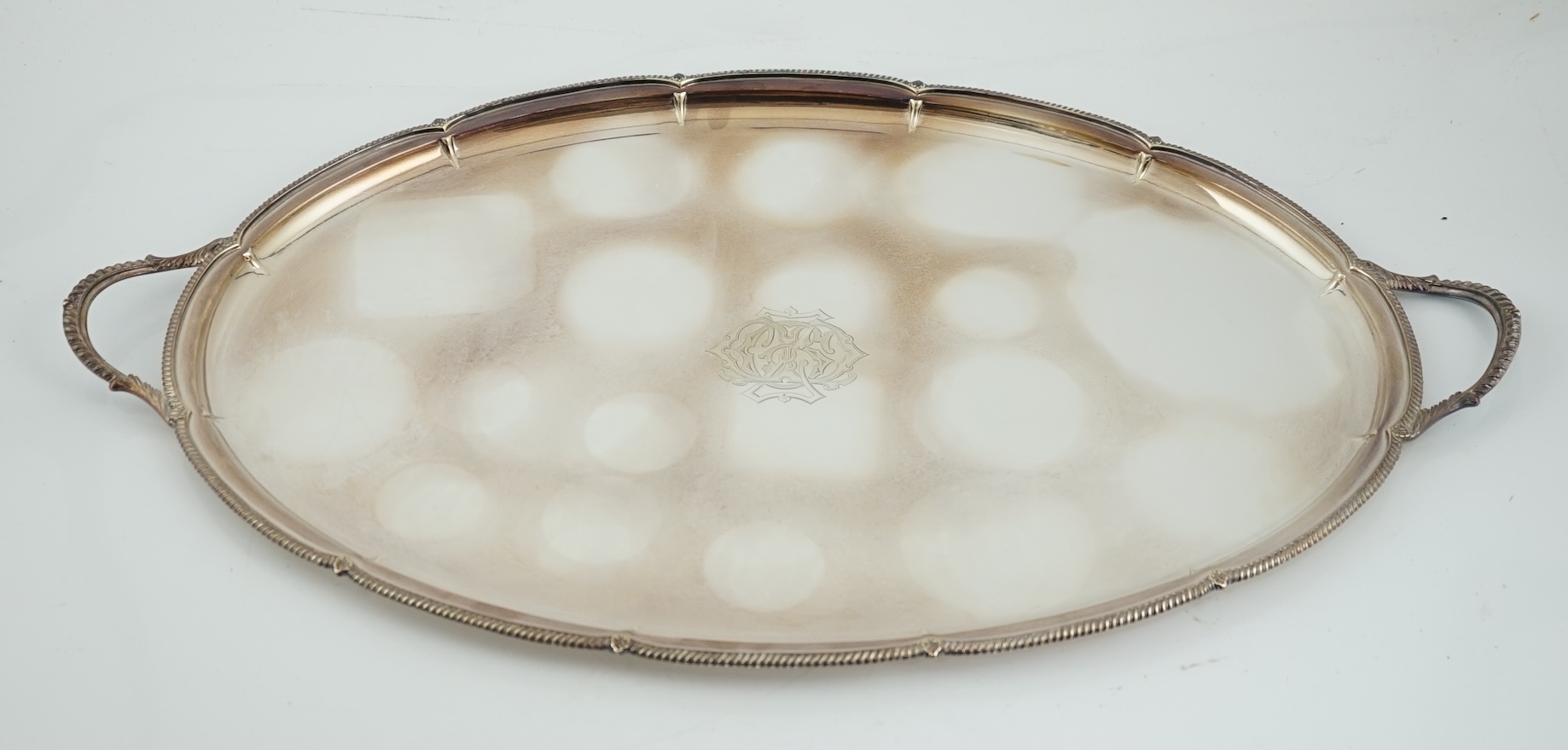 An Edwardian silver oval two handled tea tray, by George Howson